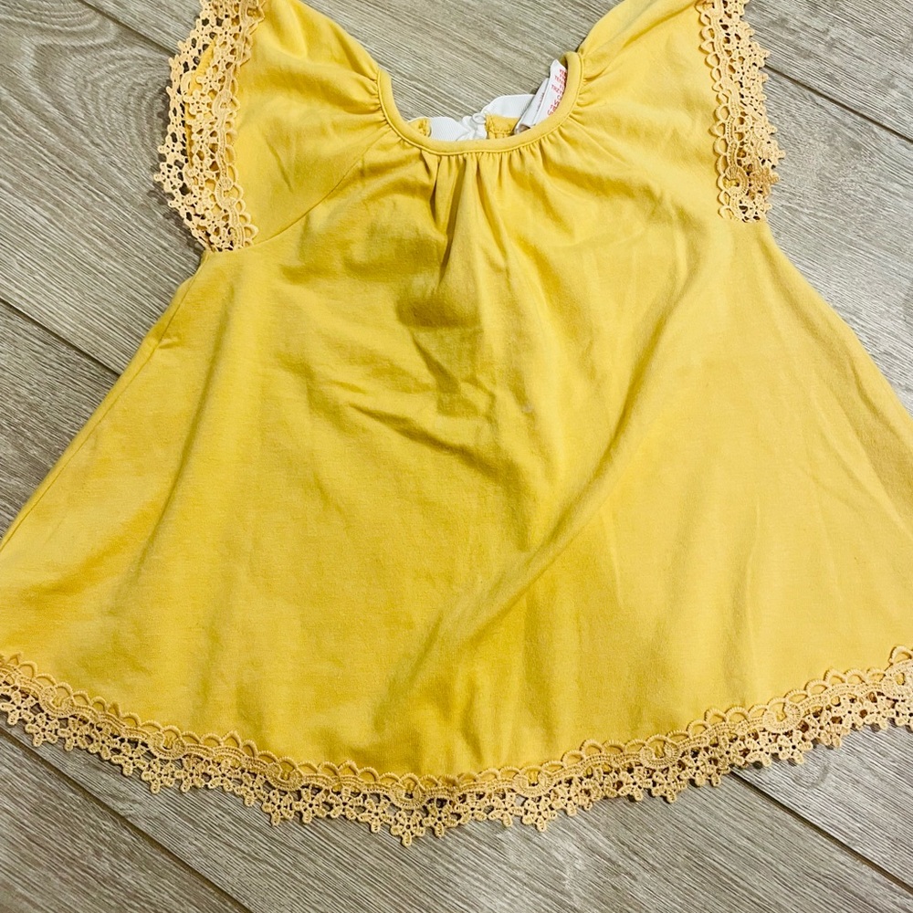 Yellow swing top 12 mo with white bow in back and detailed hem